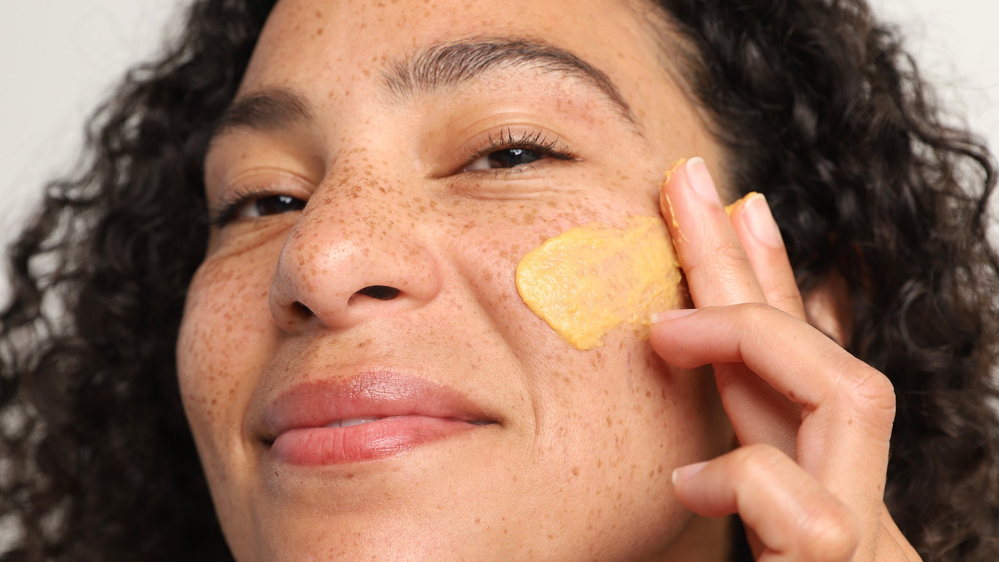 girl using our enzymatic exfoliator