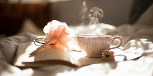 Image of a hot tea cup on a book